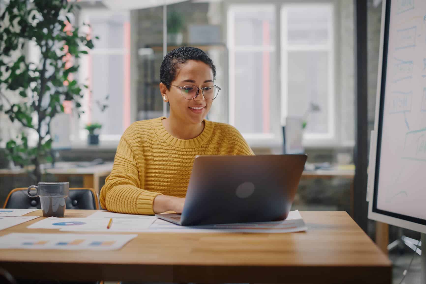 employee types at office desk