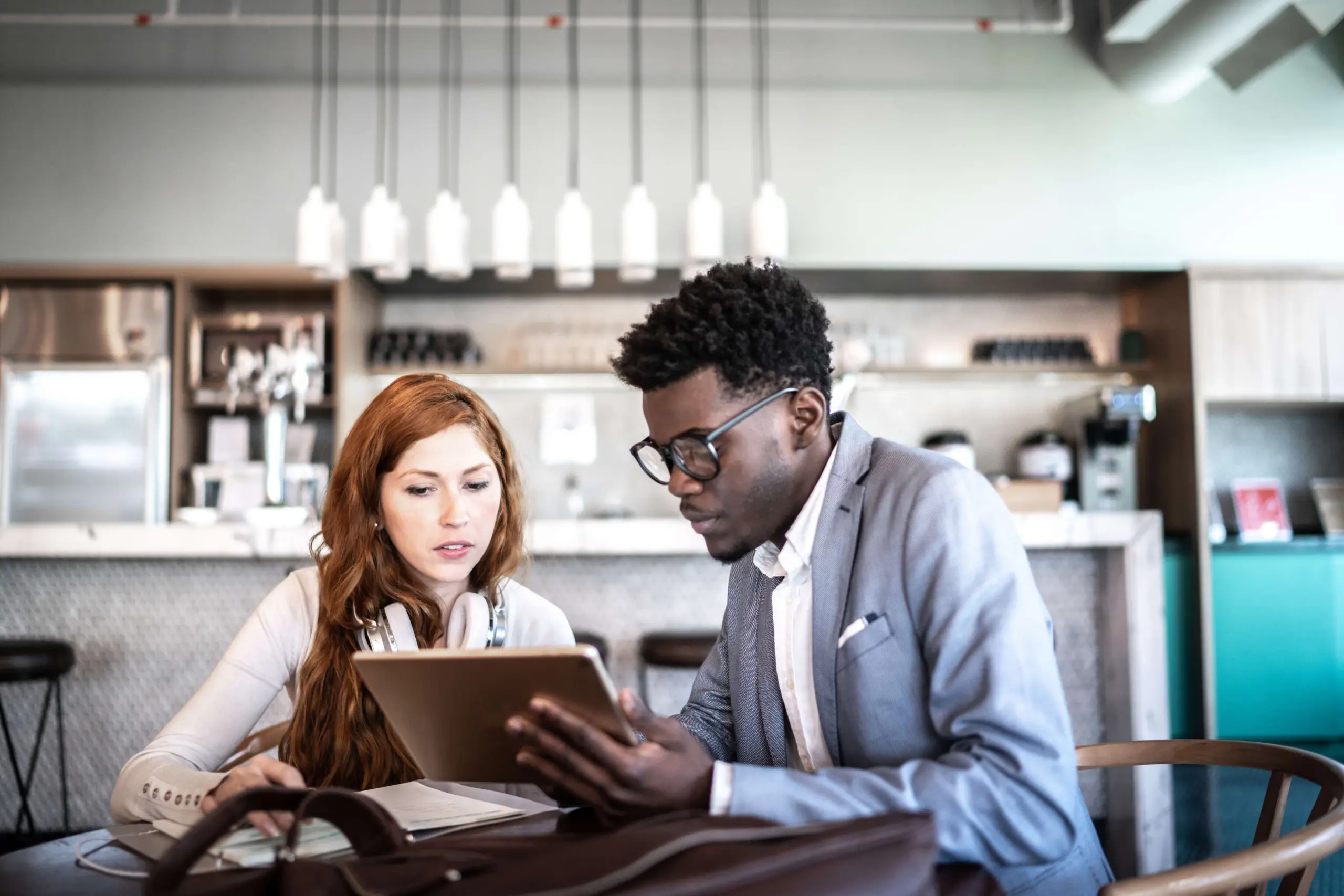 diverse colleagues look at tablet