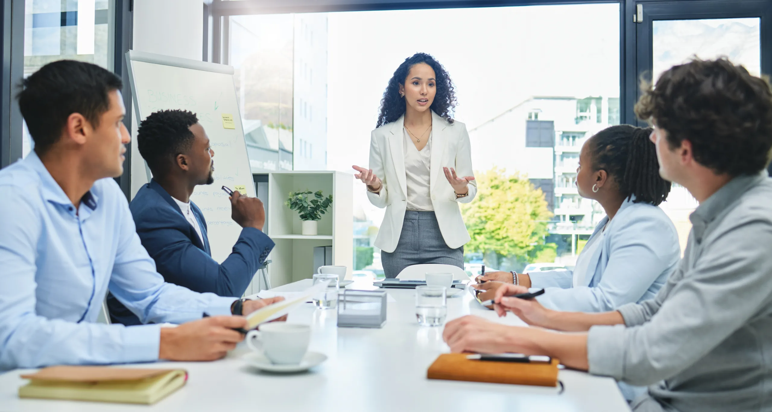 A group of young professionals looking engaged in a conference room