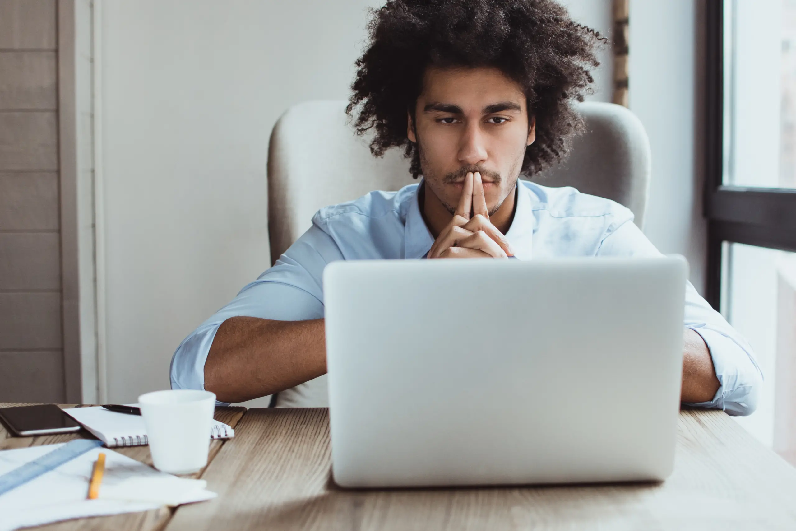 Executive looking pensively at computer