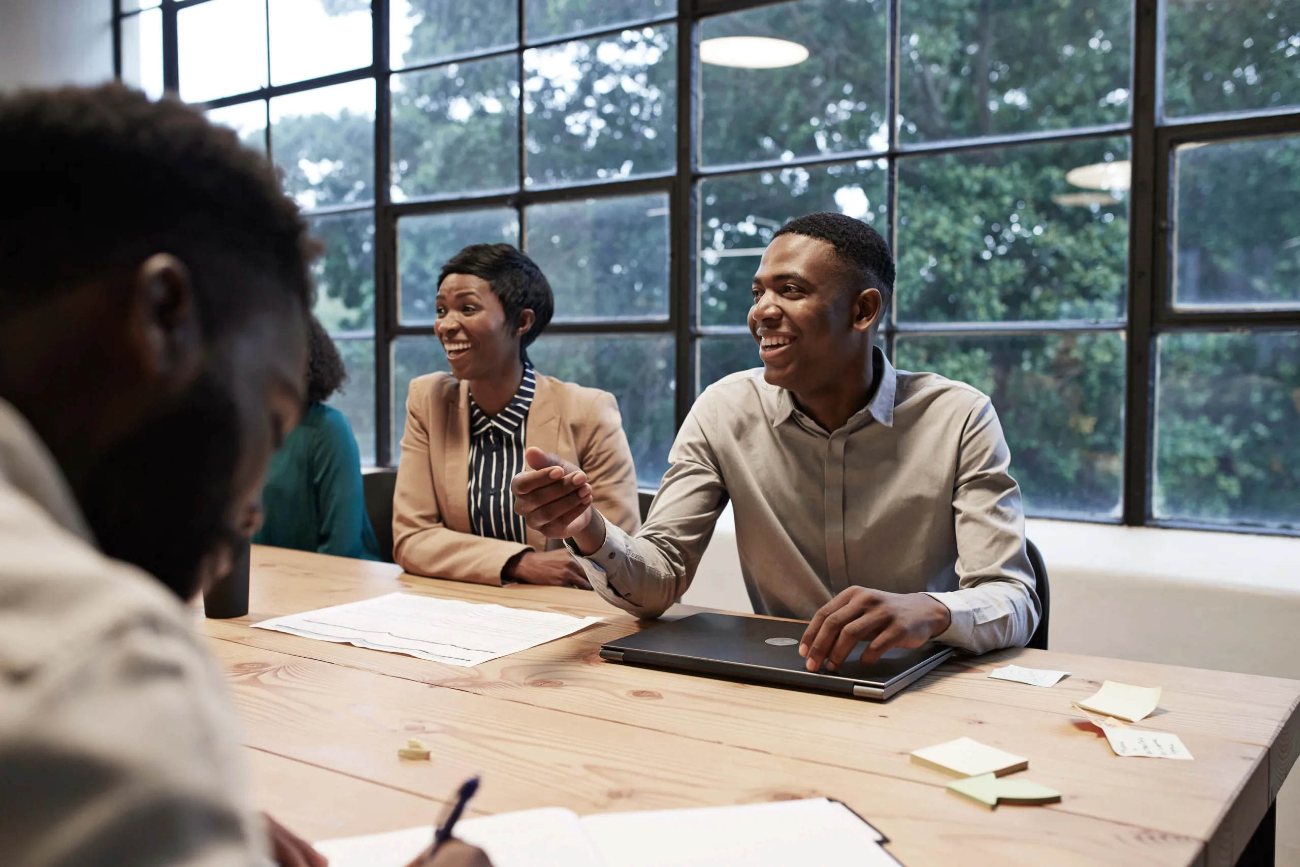 smiling business professionals office table